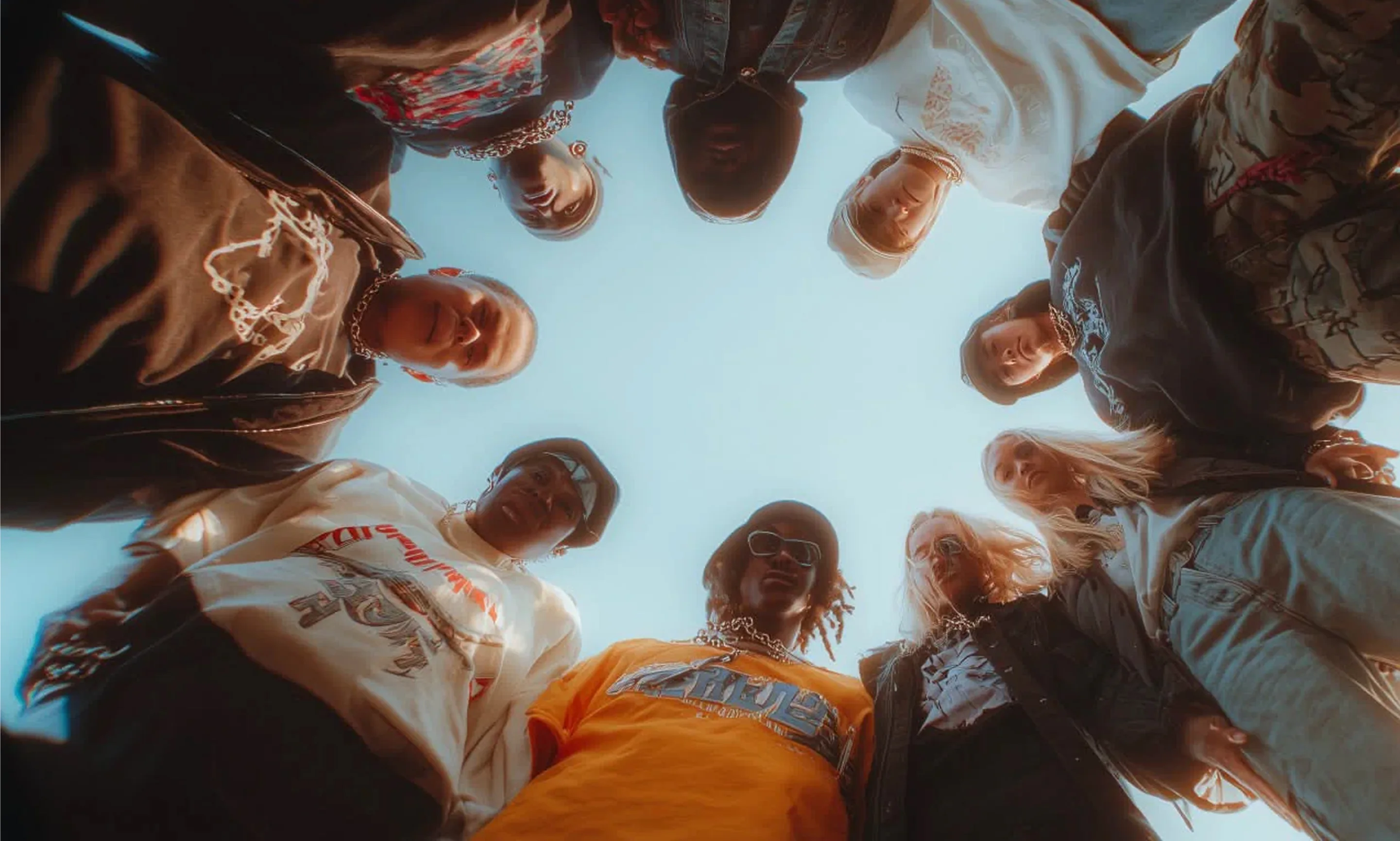A diverse group of friends gathering in a circle